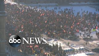 Truckers protest at USCanada border over vaccine mandates [upl. by Ardnad590]